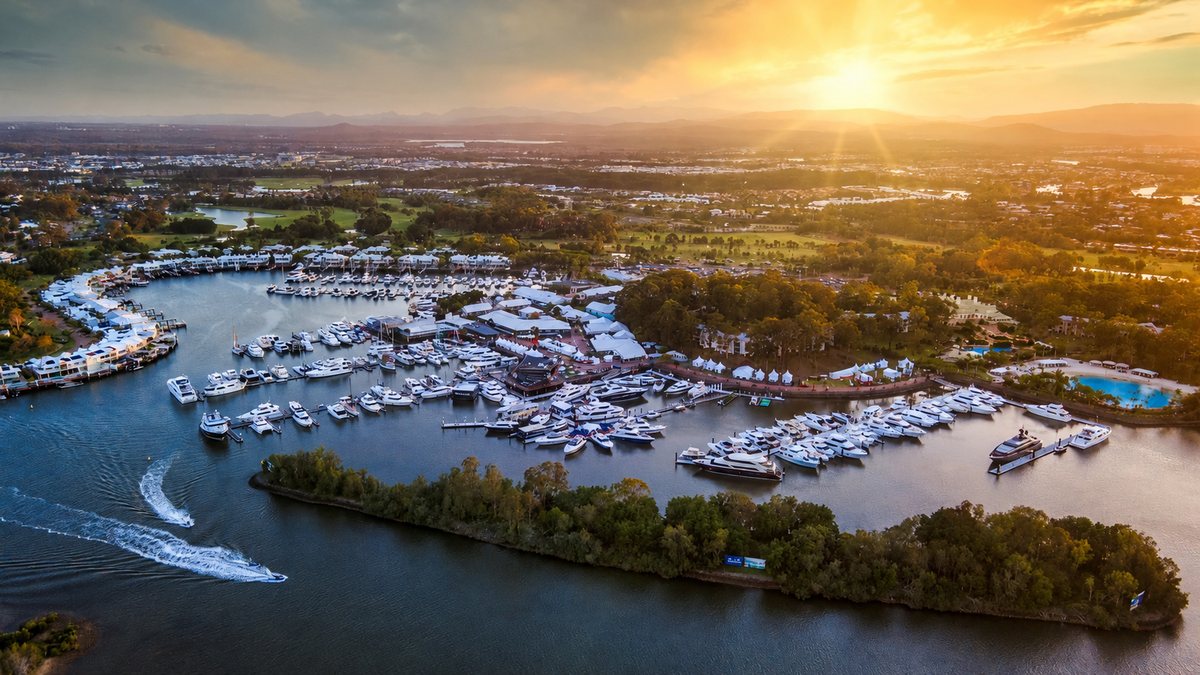 Aerial view of a marina full of boats at sunset